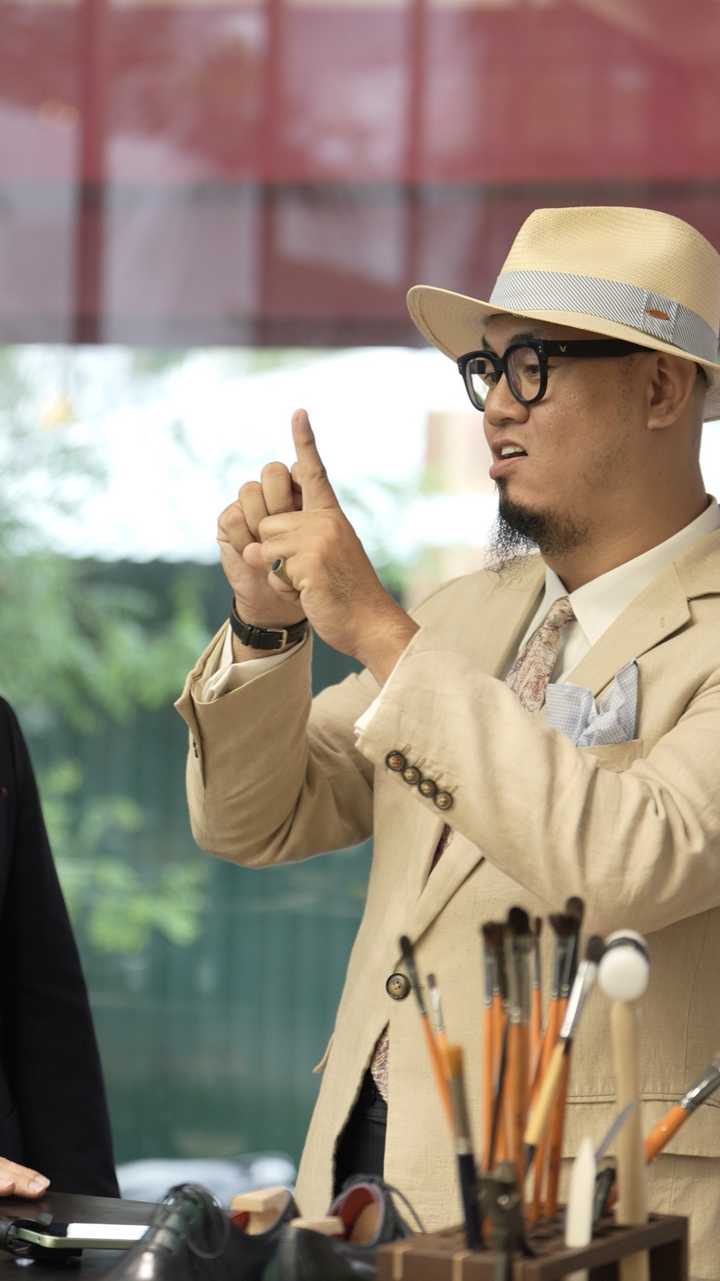 Nguyen Hoang Sebastian explaining at the Marcher counter