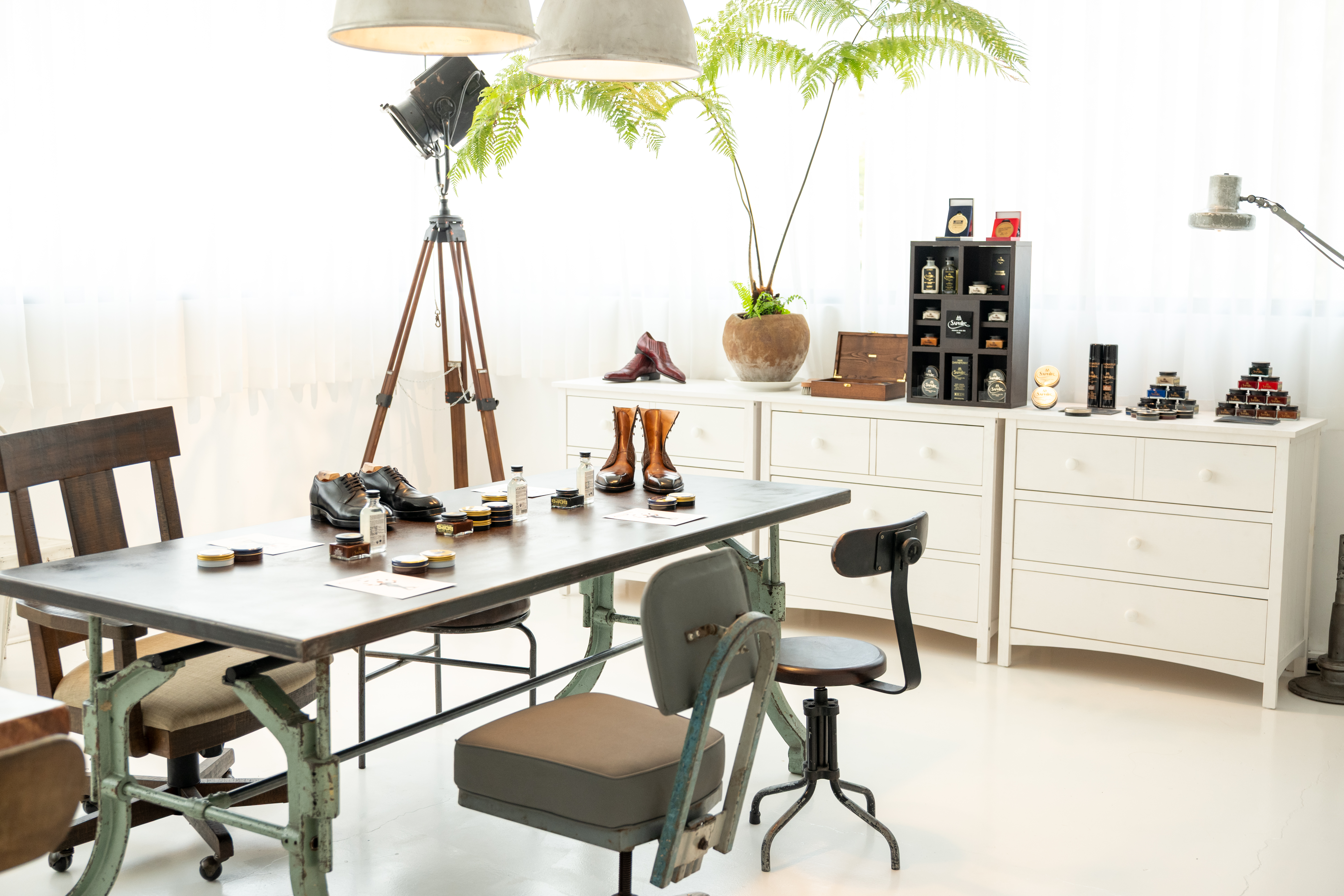 The Ritual workshop setup — shoes and Saphir products arranged on the work table