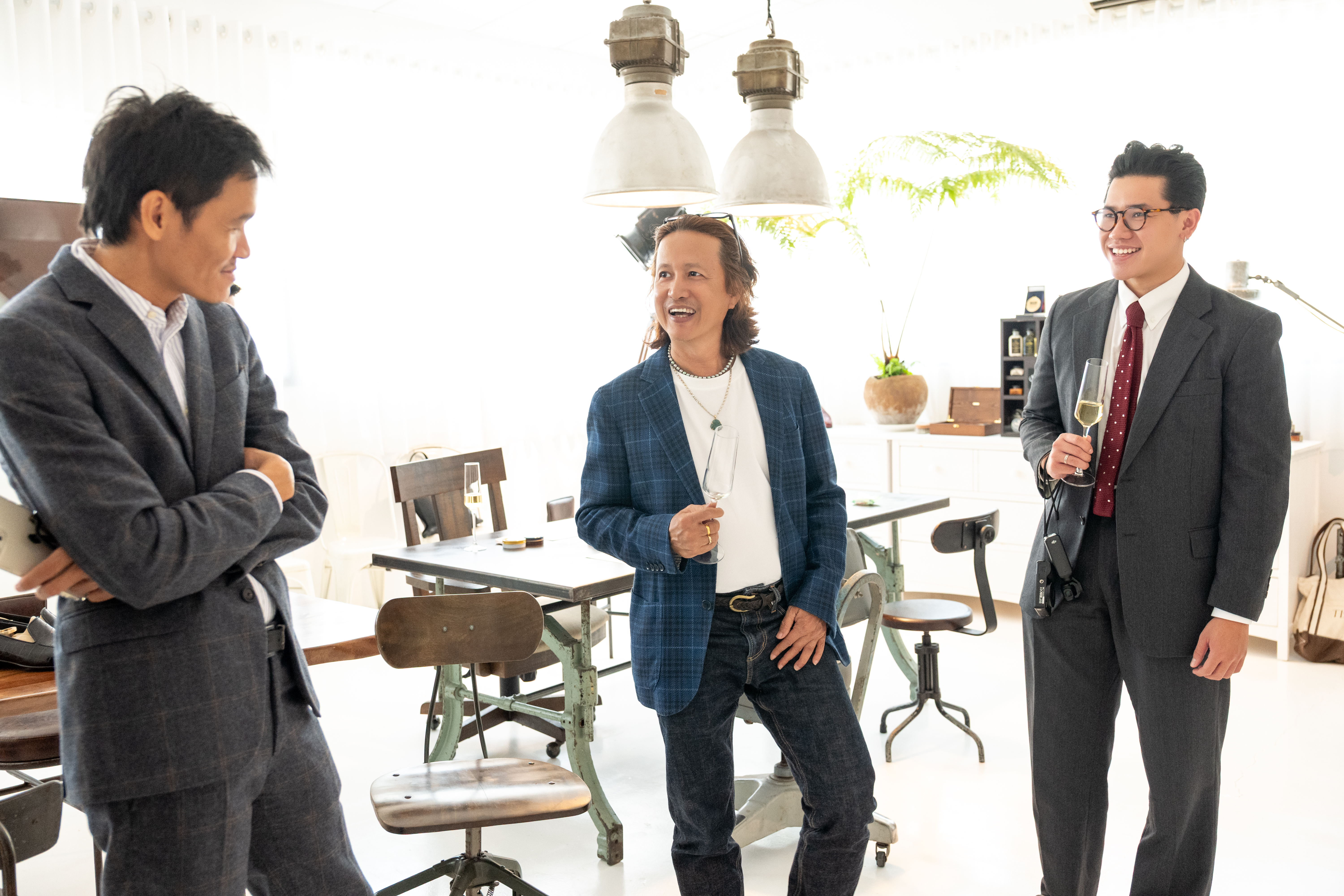 Guests connecting at The Ritual — suits, champagne, conversation